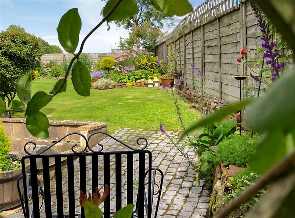 Paved slope to the patio area and entrance at Capelrig Cottage in Glasgow, Lanarkshire