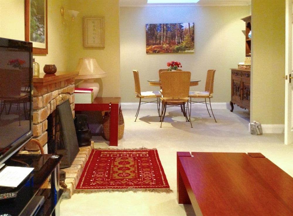 Spacious living and dining room at Capelrig Cottage in Glasgow, Lanarkshire