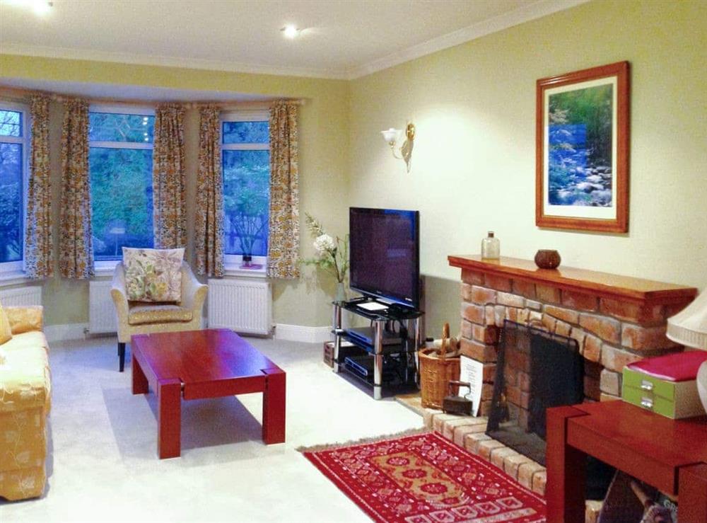 Welcoming living area at Capelrig Cottage in Glasgow, Lanarkshire