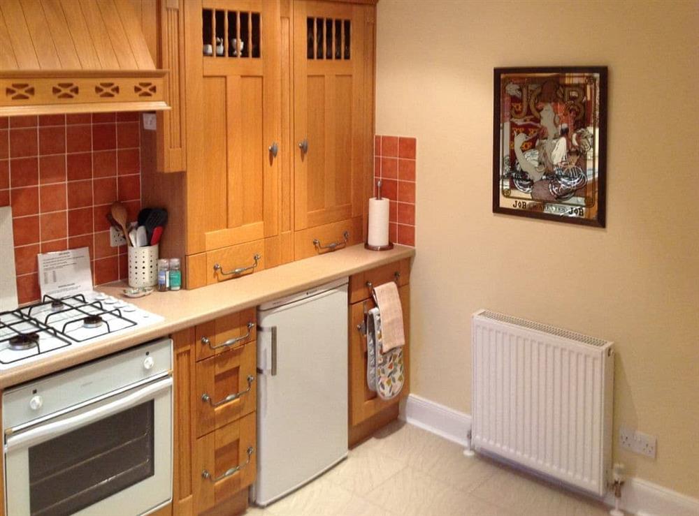 Well-equipped fitted kitchen at Capelrig Cottage in Glasgow, Lanarkshire