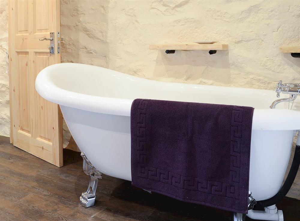 Freestanding roll top bath in the double bedroom at Capercaillie Cottage in Rhilochan, Rogart, near Dornoch, Highlands, Sutherland