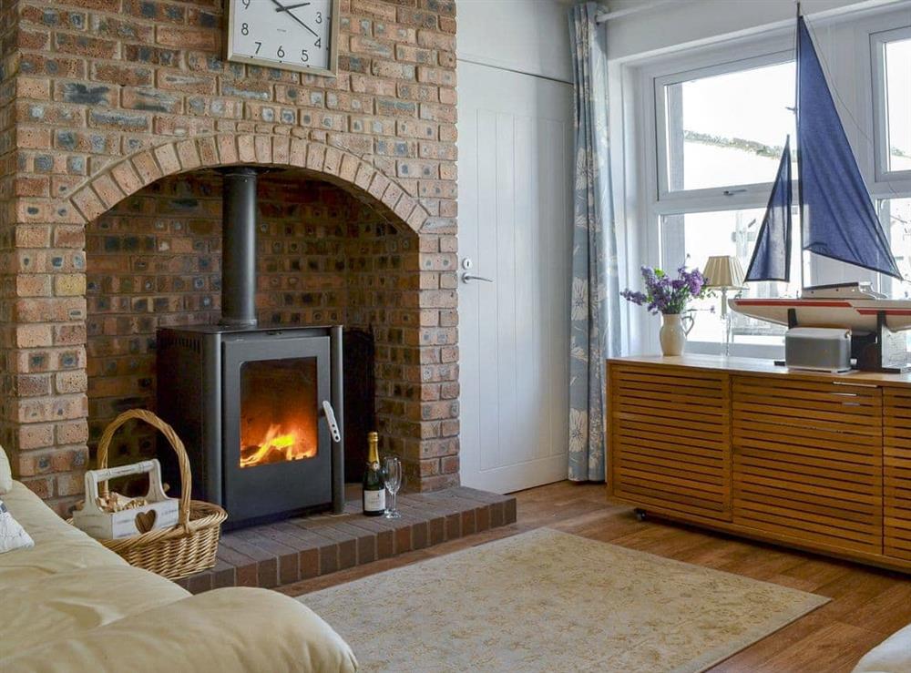 Charming living room with wood burner at Captains Cottage in Allonby, near Maryport, Cumbria