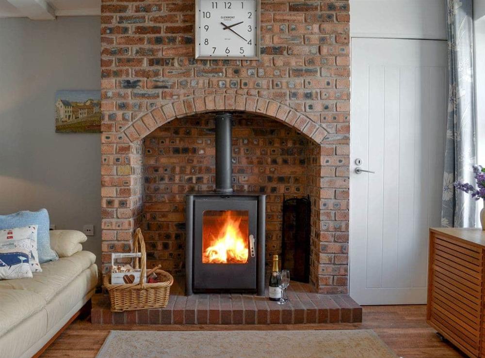 Cosy wood burner at Captains Cottage in Allonby, near Maryport, Cumbria