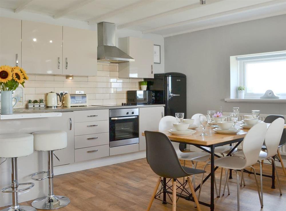 Well equipped kitchen/ dining area at Captains Cottage in Allonby, near Maryport, Cumbria