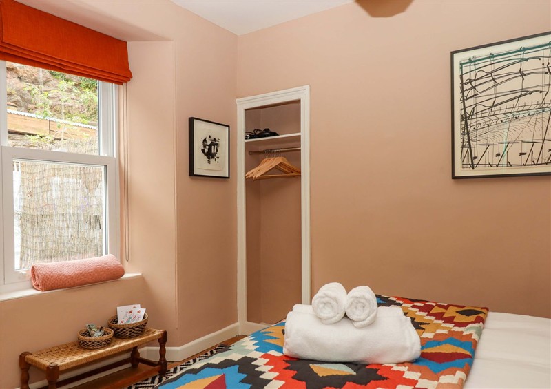 A bedroom in Captains Cottage at Captains Cottage, Brixham
