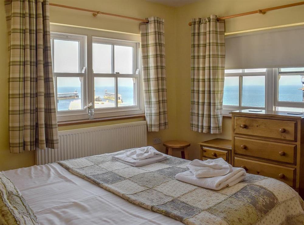 Double bedroom with stunning sea views at Captains Cottage in Whitby, North Yorkshire