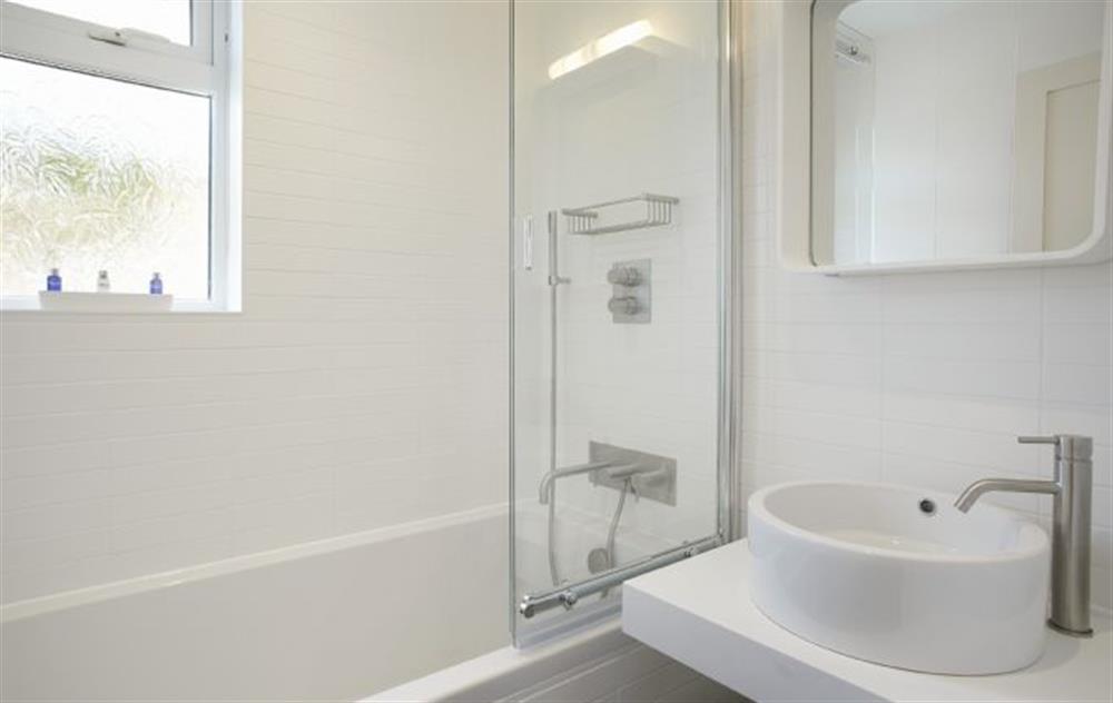 Renovated to a high standard contemporary design bathroom with shower above at Captains House, Marazion
