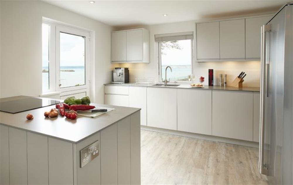 The kitchen is beautifully renovated with a classic colour scheme stylish practical contemporary design with high spec appliances selected by an Interior Designer. Magnificent sea views whilst you prepare delicious local produce
