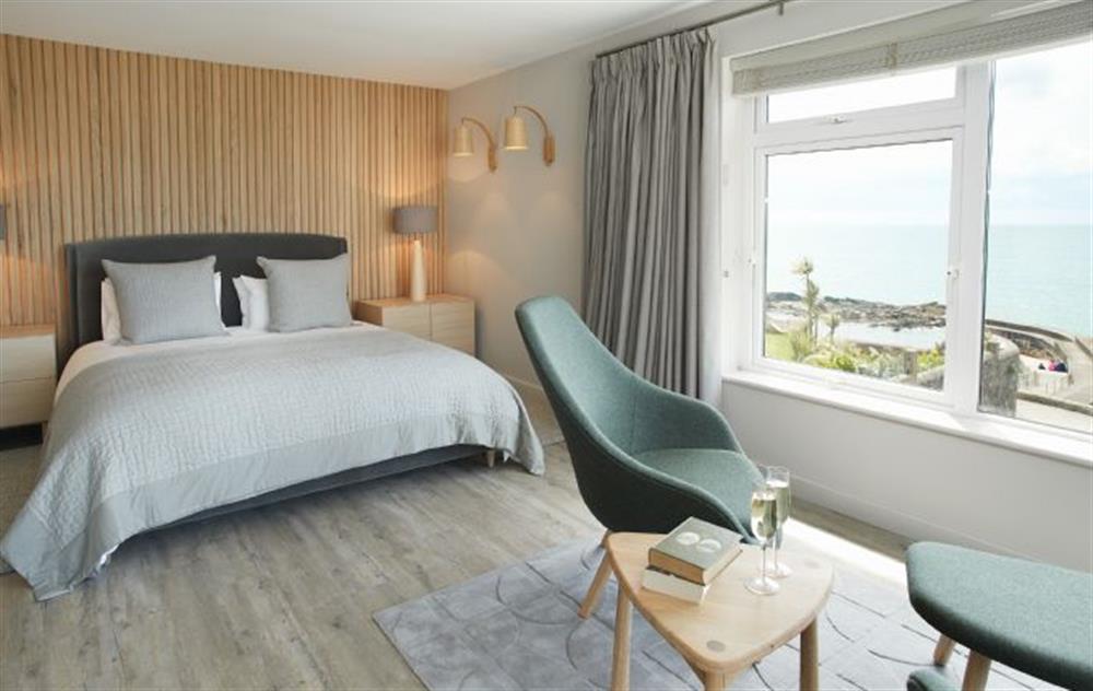 The master bedroom is beautifully renovated with a 6’ bed reading area with a unique 180 degree sea views of St Michael’s Mount