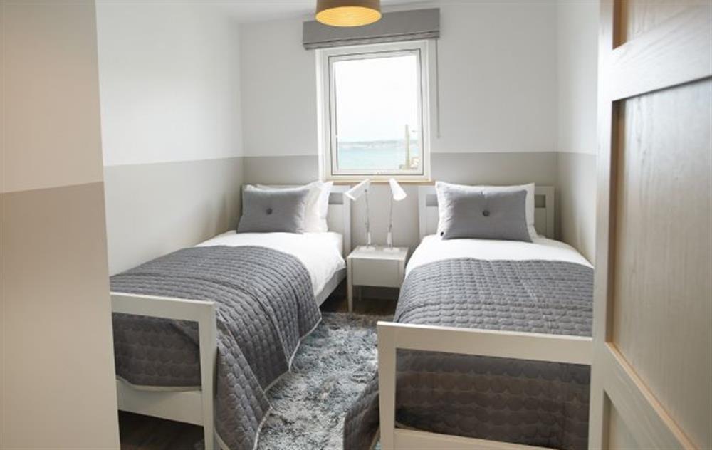 Twin bedroom with stylish neutral colour palette  at Captains House, Marazion