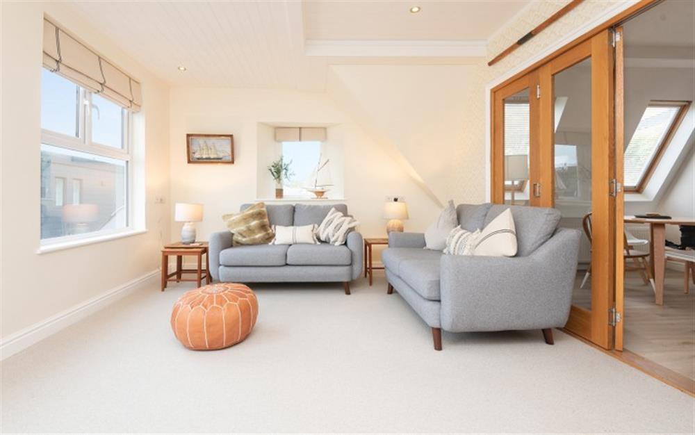 The lounge area, with bifold doors opening to the kitchen dining room allows for flexible living. at Captain's Lookout in Kingsbridge