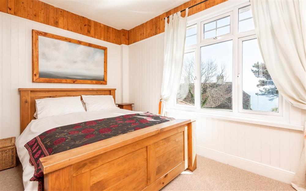 The master bedroom with sea views at Captain's Lookout in Stoke Fleming