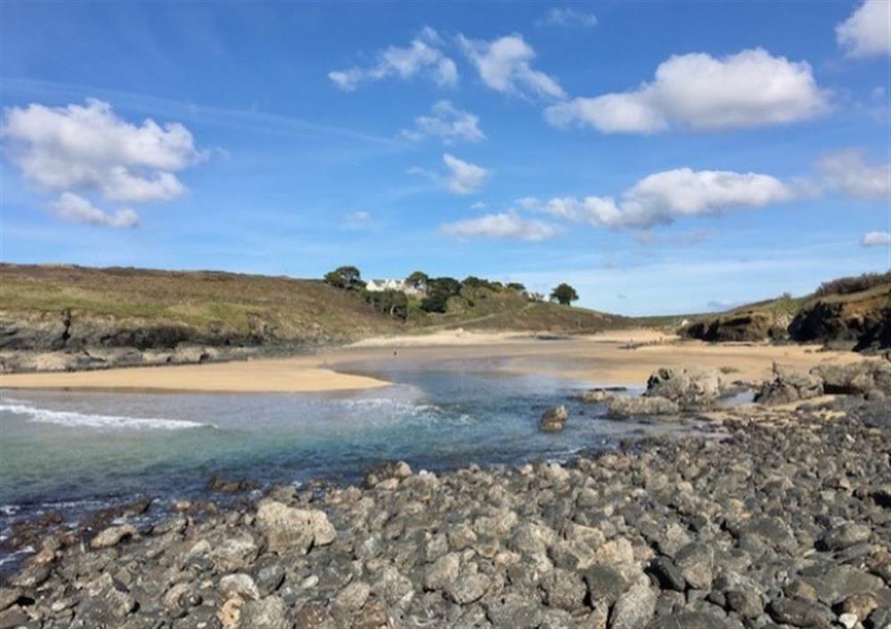 Poldhu Beach, close to Mullion, is great for exploring, plus there is a super cafe there for lunches or ice creams. at Carabone Cottage in The Lizard