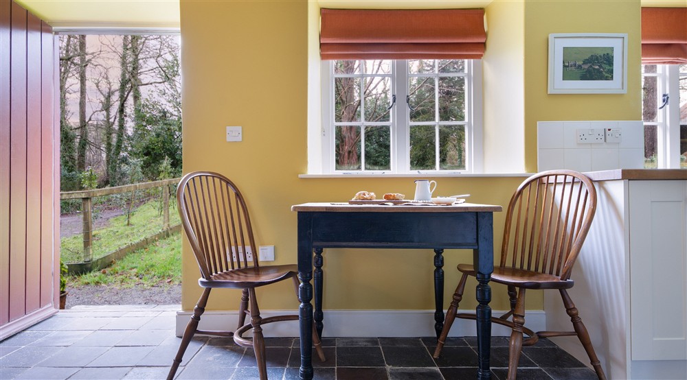 The table for two in the living space at Cariad Cottage in Llandeilo, Carmarthenshire