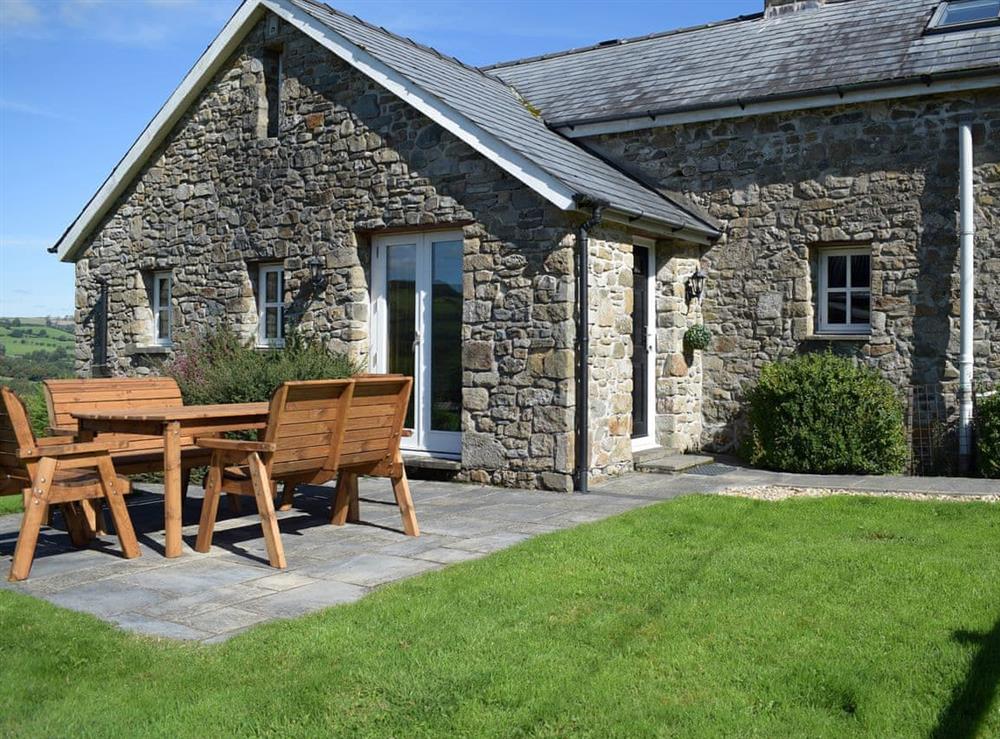 Paved patio area with outdoor eating area at Carmarthen Cottages- Barn Cottage in Cwmdu, near Carmarthen, Dyfed