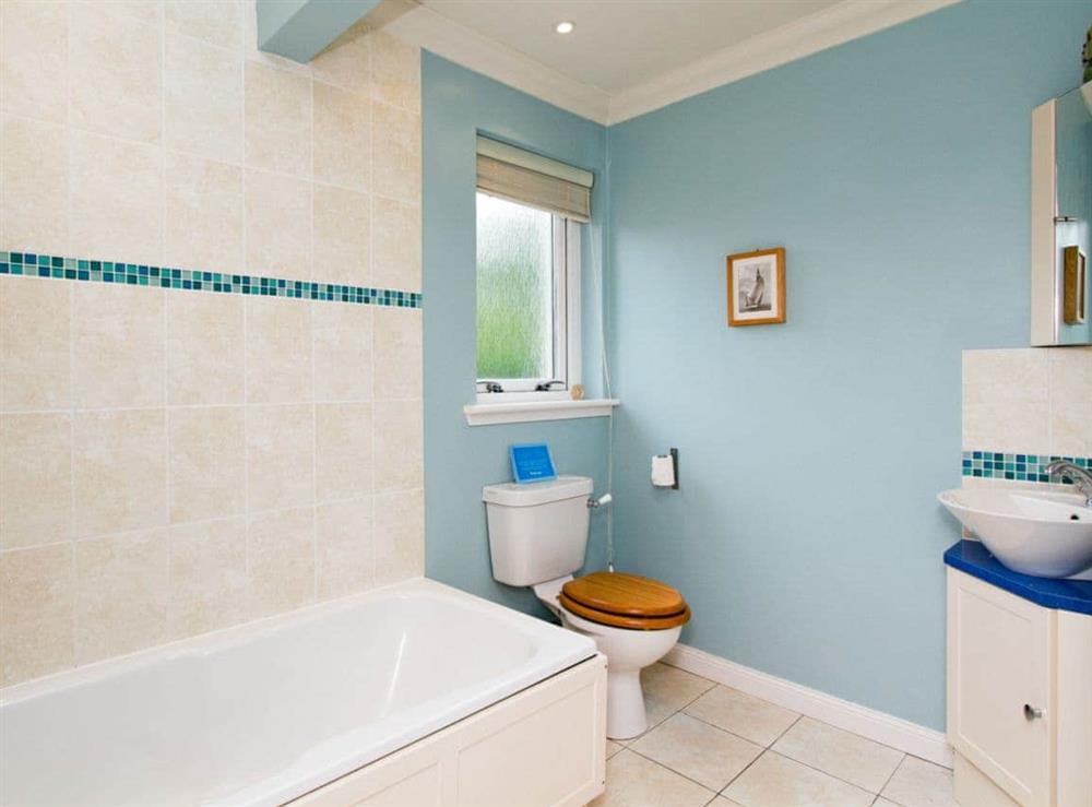 Stylish bathroom with over-bath shower at Carness West in West Carness, By Fort William., Inverness-Shire