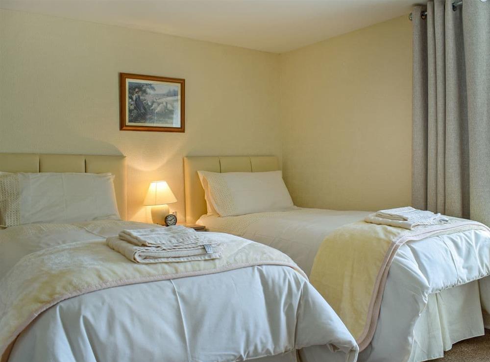 Elegant twin bedroom at Caroch Cottage in Comrie, near Crieff, Perthshire