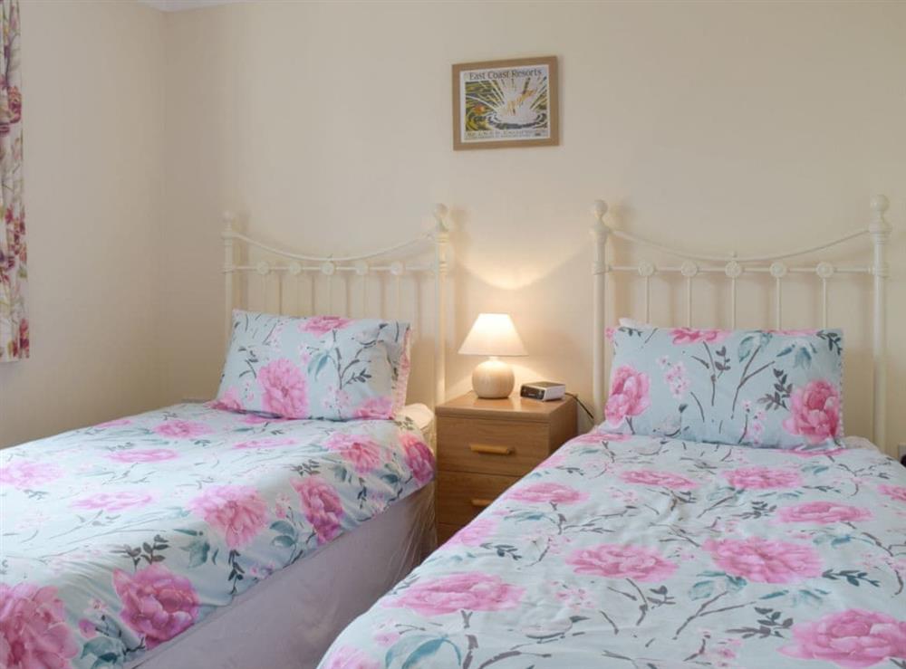 Comfortable twin bedroom at Carols Cottage in Halesworth, Suffolk