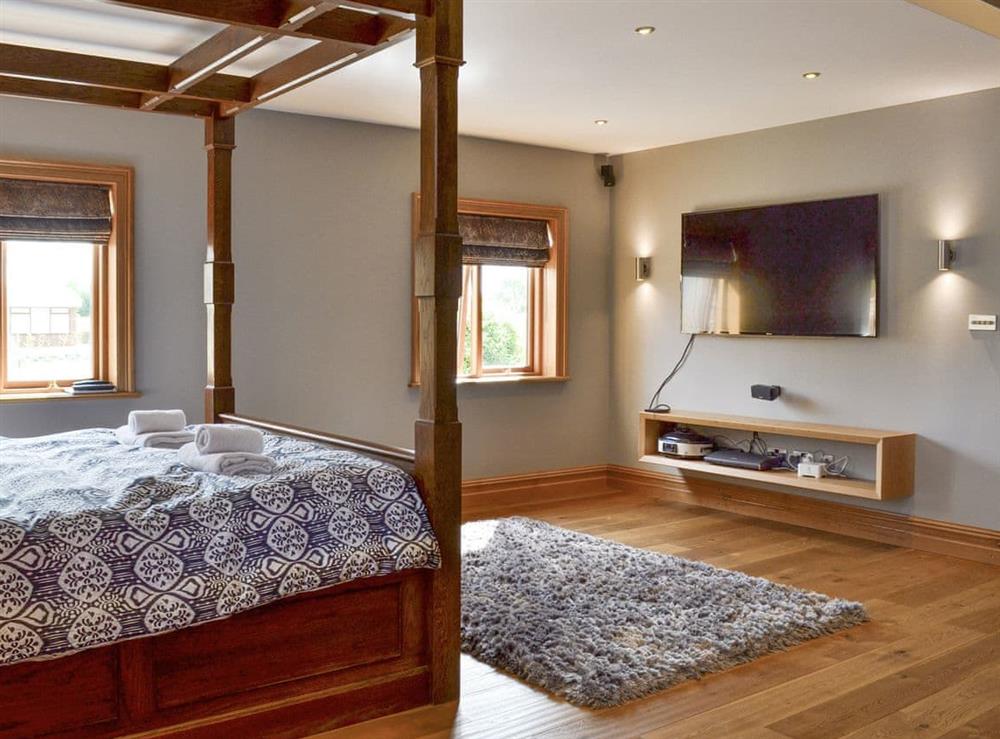 Peaceful four poster double bedroom at Carr End Barn A in Stalmine, near Poulton-le-Flyde, Lancashire