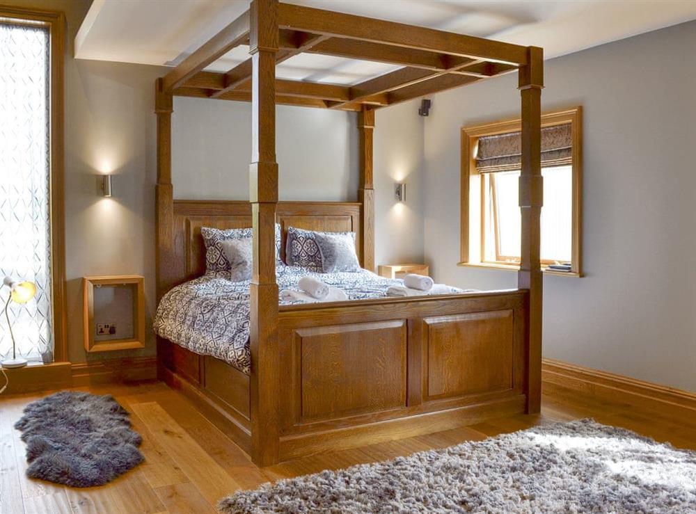 Relaxing four poster double bedroom at Carr End Barn A in Stalmine, near Poulton-le-Flyde, Lancashire