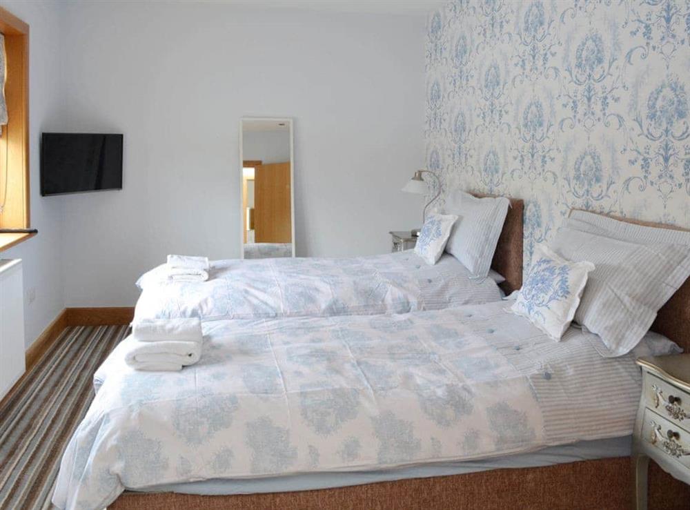 Stylishly decorated twin bedroom at Carr End Barn in Stalmine, near Poulton-le-Fylde, Lancashire