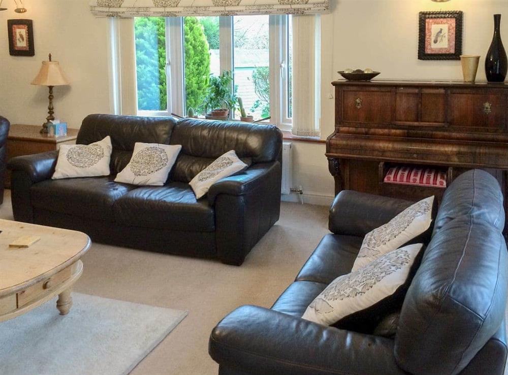 Comfortable living room with a cosy open fire at Carr House in Cayton, Scarborough, N.Yorks., North Yorkshire