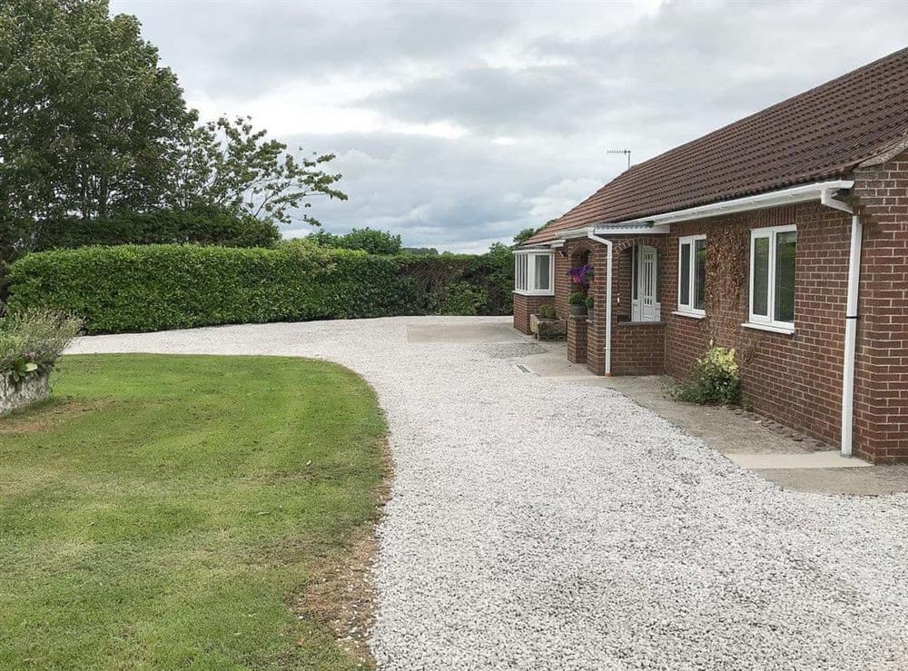 Gravelled parking area for up to four cars at Carr House in Cayton, Scarborough, N.Yorks., North Yorkshire