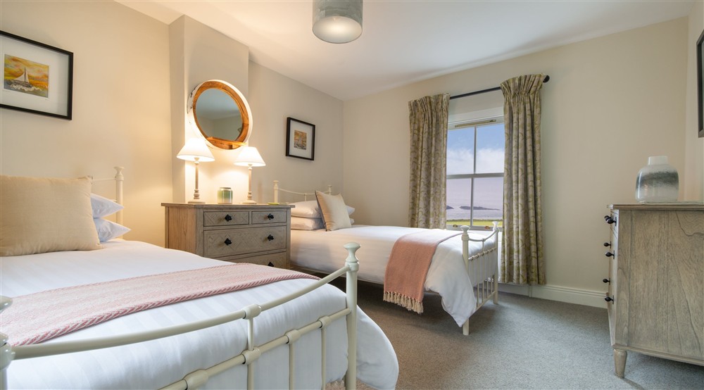 Twin bedroom, Carrick-a-Rede Cottage, Northern Ireland at Carrick-a-rede Cottage in Ballycastle, County Antrim
