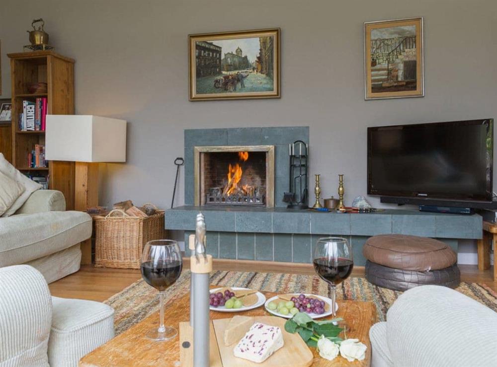 Relax in the large living room with open fire at Carsaig in Brig o’Turk, near Callander, Perthshire