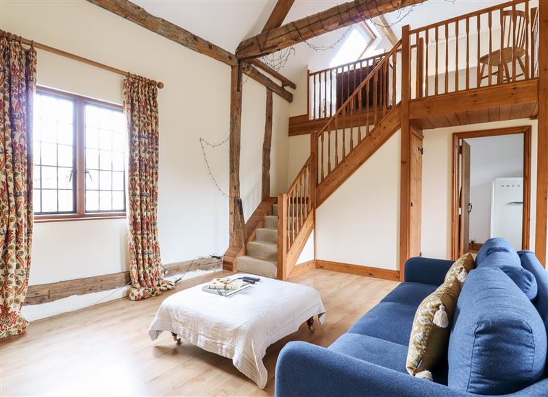 Enjoy the living room at Cart Wheel Cottage, Steeple Bumpstead