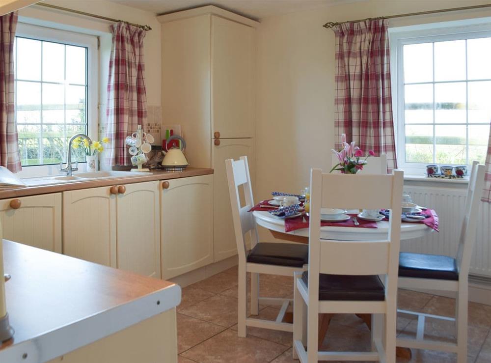 Kitchen with dining area at Carthouse Cottage, Cosheston in Pembroke Dock, Dyfed