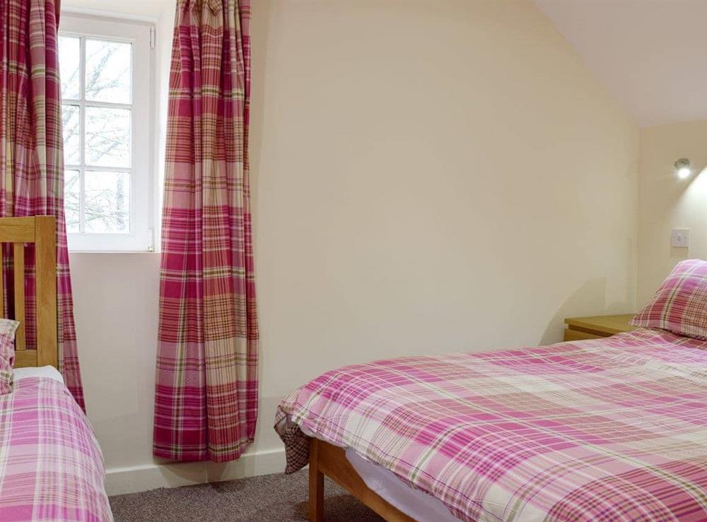 Bedroom with comfy double bed and an additional single bed (photo 2) at Carthouse Cottage in Ivy Court Cottages, Llys-y-Fran, Dyfed