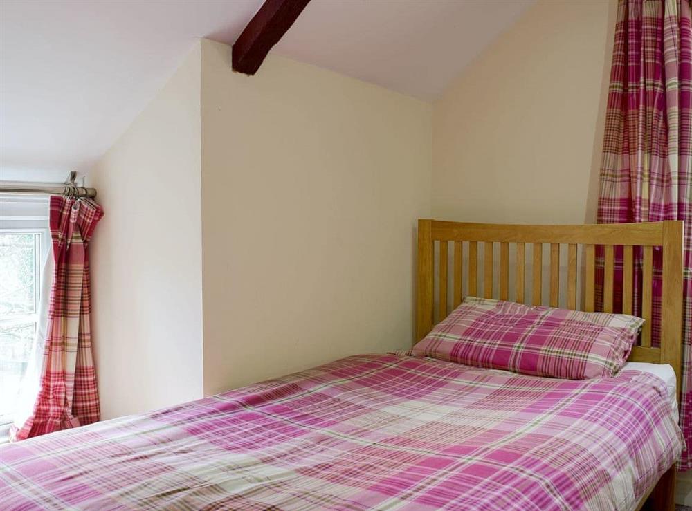 Bedroom with comfy double bed and an additional single bed (photo 3) at Carthouse Cottage in Ivy Court Cottages, Llys-y-Fran, Dyfed