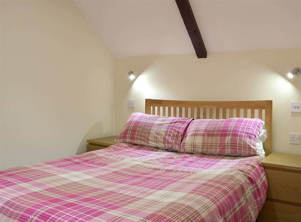 Bedroom with comfy double bed and an additional single bed at Carthouse Cottage in Ivy Court Cottages, Llys-y-Fran, Dyfed