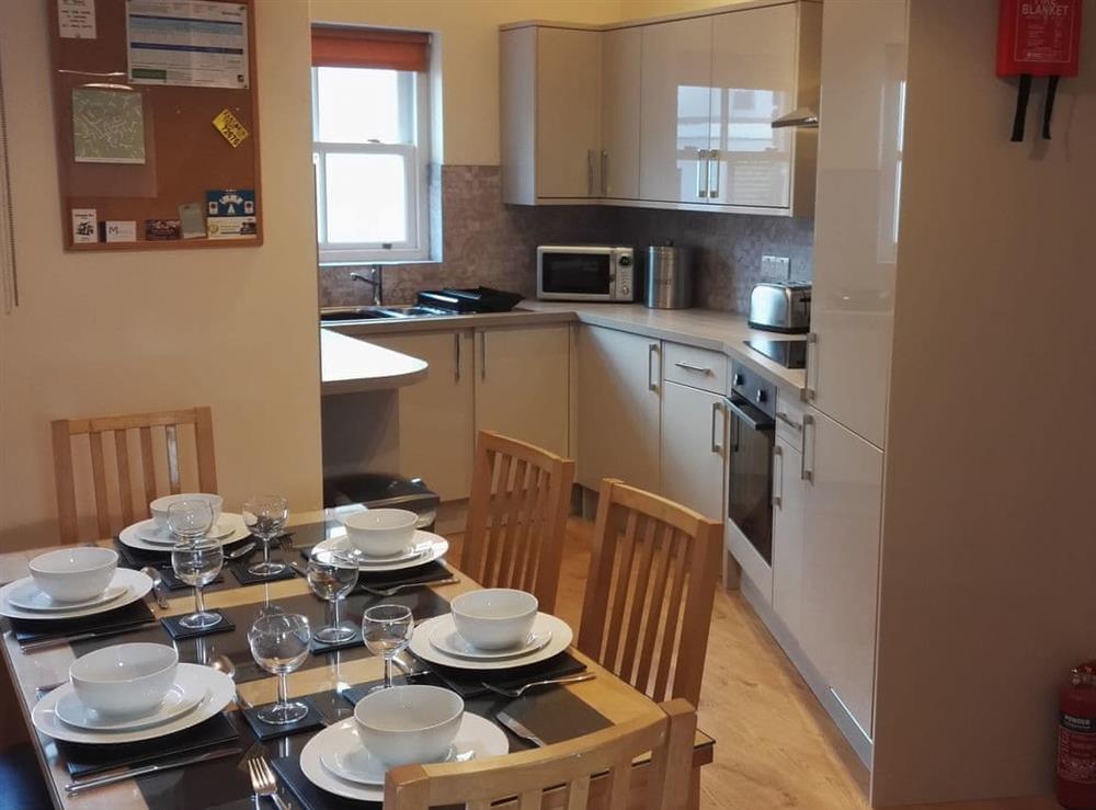 Dining area and adjacent kitchen at Carthwaite in Keswick, Cumbria