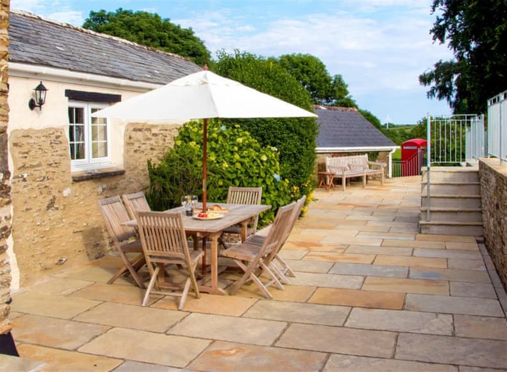 Patio with garden furniture and barbecue (photo 2) at Caros Cottage, 