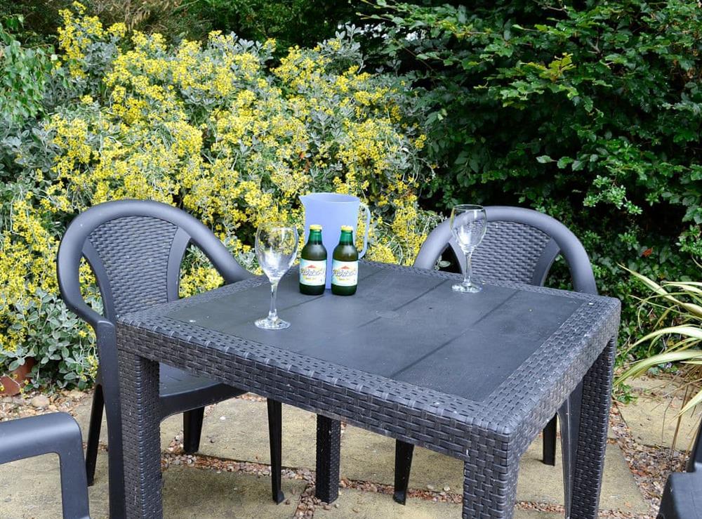 Private patio garden with table and chairs at Cartref in Llysfaen Village, near Old Colwyn, Clwyd