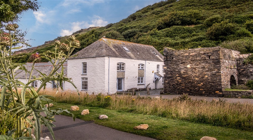 The National Trust building in Boscastle, with the entrance to The Gaffer and The Clinker down the lane, closest to the lime kiln wall, Cornwall at Cartref in Nr. Beddgelert, Gwynedd
