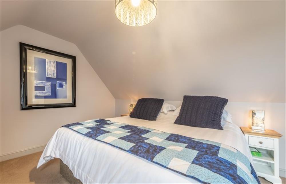 First floor: Bedroom with a super-king size bed  at Cartshed Lodge, Hoveton near Norwich