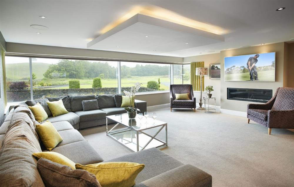 Spacious open plan sitting area with stunning views at Carus House, Burneside