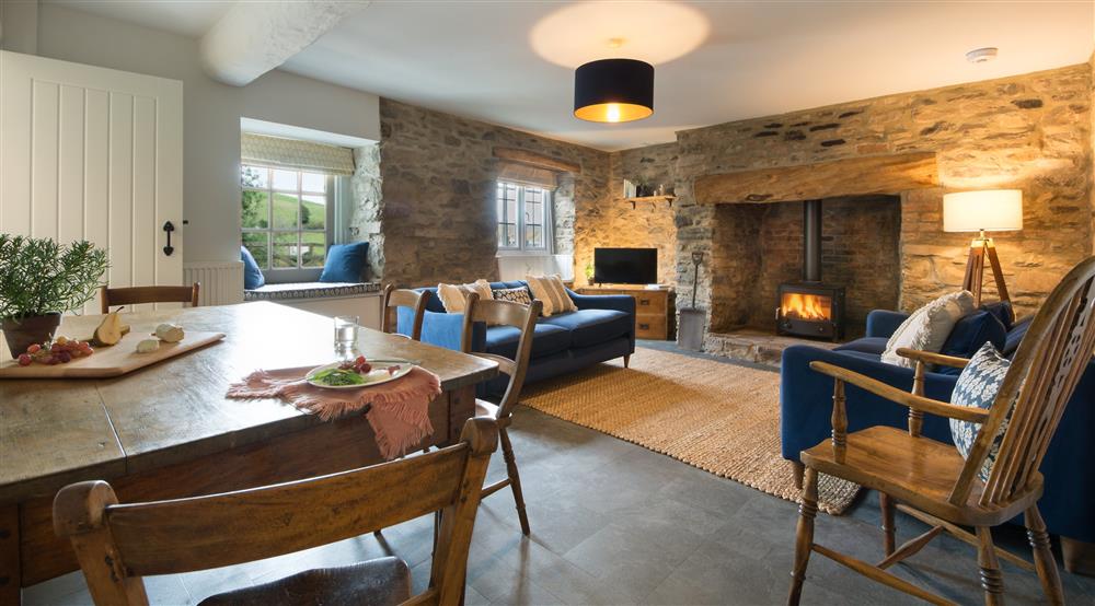 The sitting and dining room at Carver Cottage in Oare, Devon