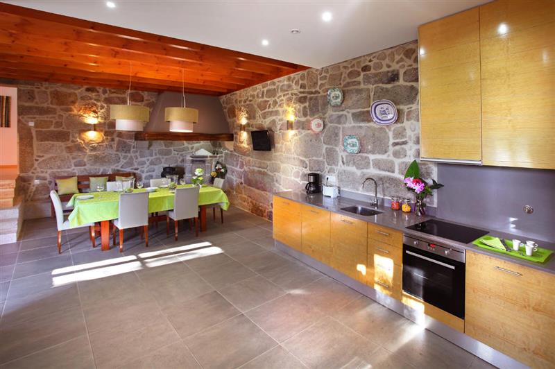 The kitchen and dining area at Casa da Cuquinha, Ponte de Lima Area, Portugal