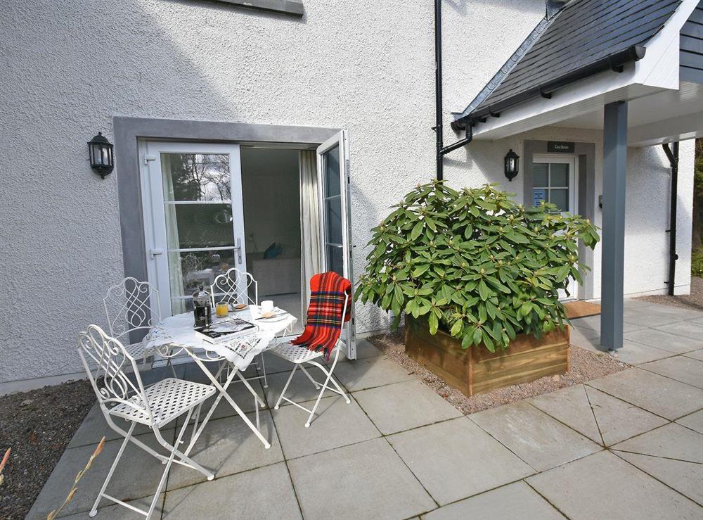 Delightful patio area with outdoor dining furniture at Casa Duran in Killin, Sterlingshire, Perthshire