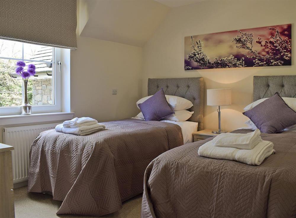 Tastefully decorated twin bedroom at Casa Duran in Killin, Sterlingshire, Perthshire