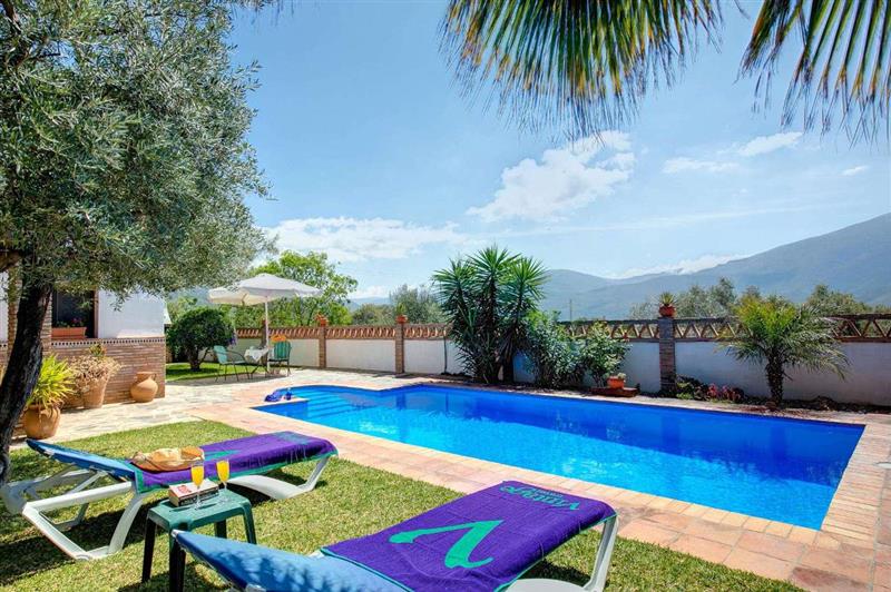Swimming pool and sun loungers at Casa Encantadora, Alpujarras (Granada), Spain
