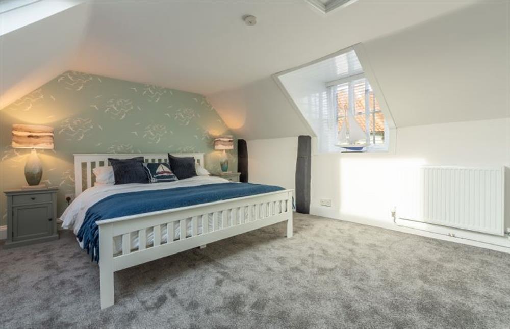 First floor: Master bedroom with king-size bed at Casamaria, Wells-next-the-Sea