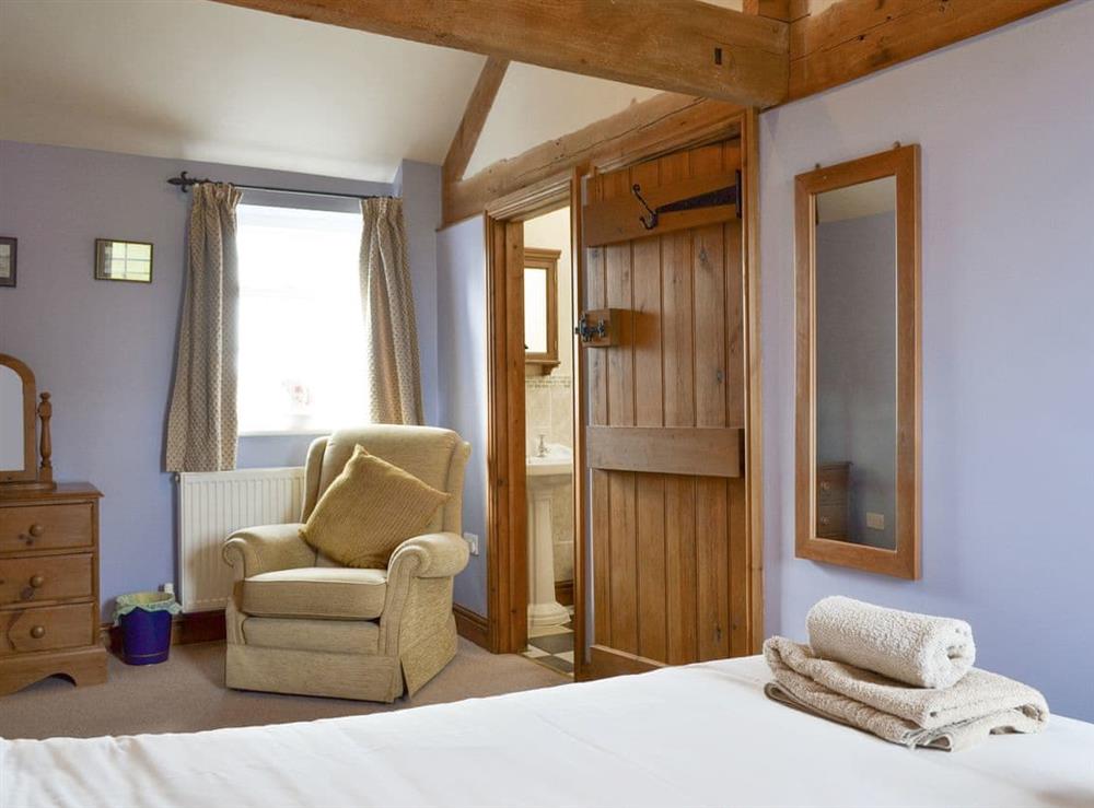 Spacious master bedroom suite at Cass Lodge in York, North Yorkshire
