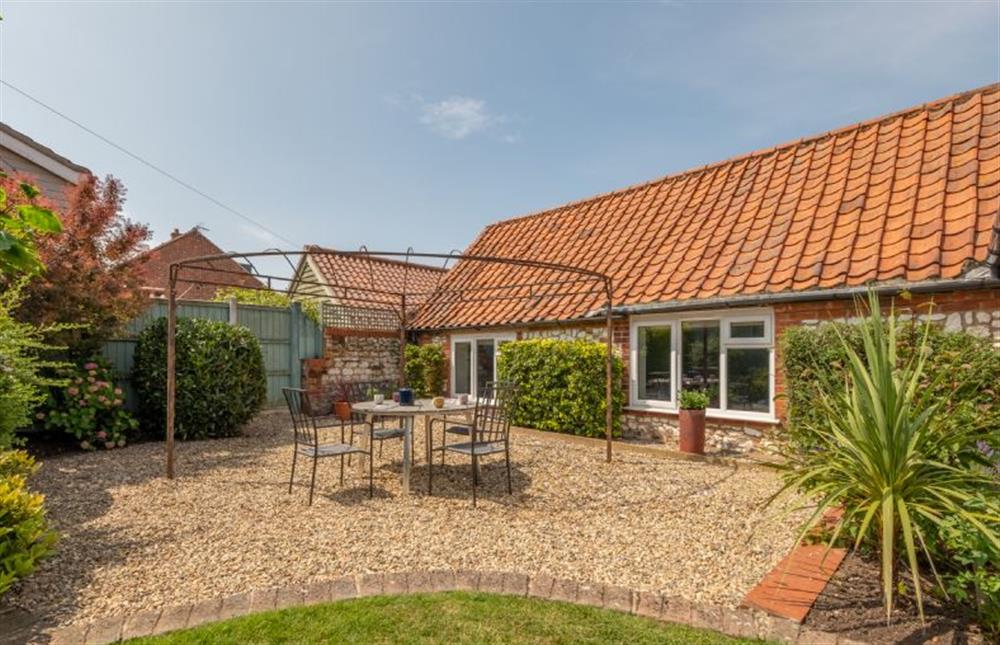 Outside: Plenty of space for soaking up the sunshine at Castle Bungalow, Thornham near Hunstanton