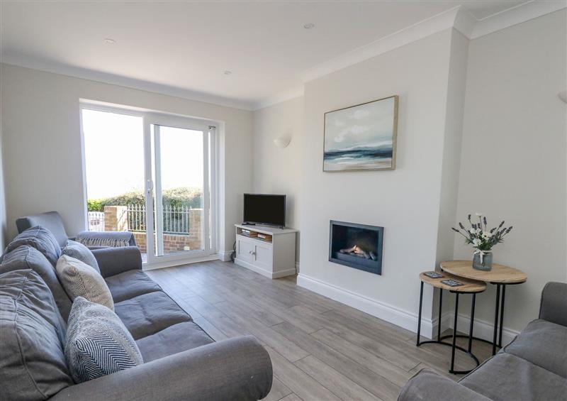 Relax in the living area at Castle Cove Cottage, Weymouth