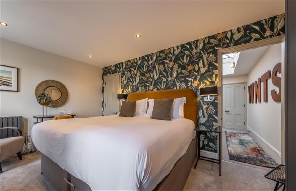 Castle House: Master bedroom with a super-king size bed at Castle House, Wells-next-the-Sea